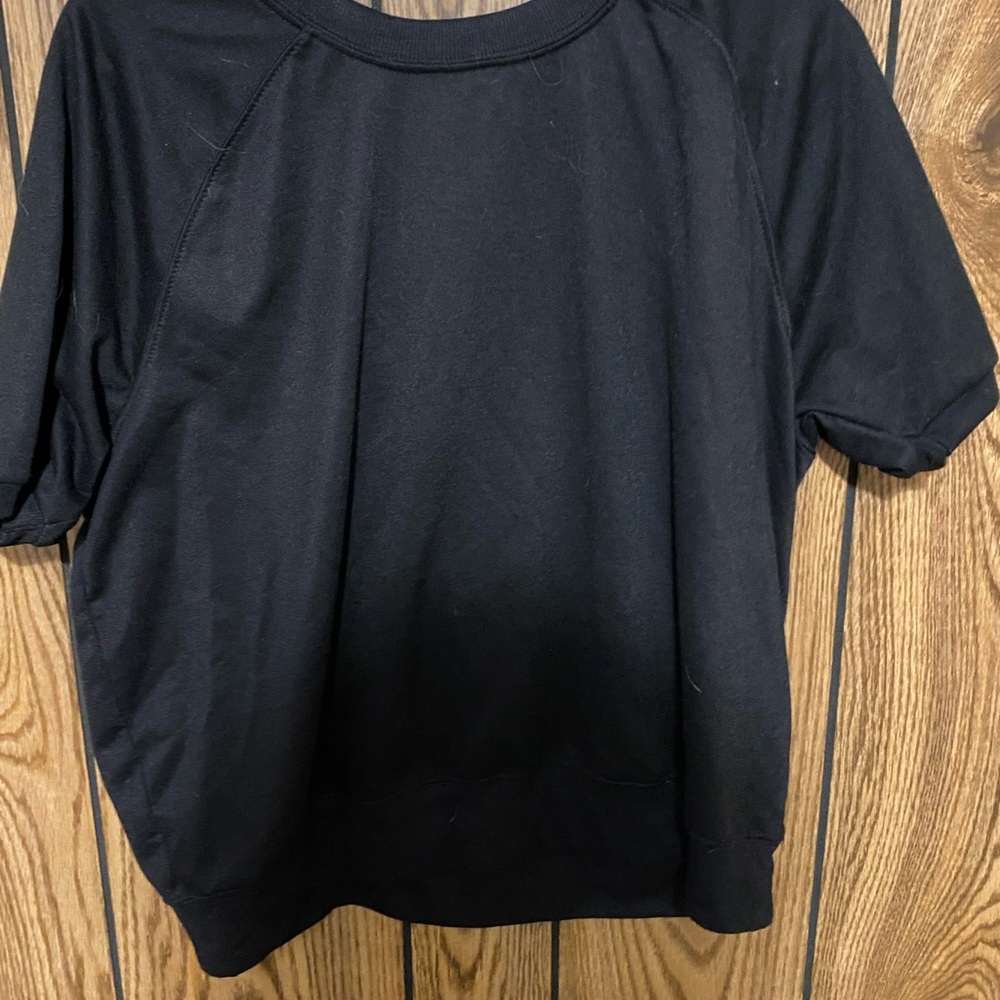 Black shirt, sleeves are kind of long, very comfortable